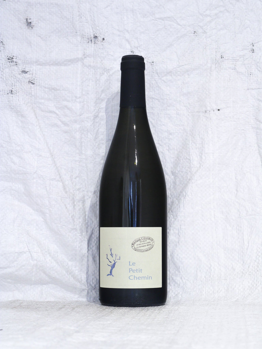 Vorderansicht der Flasche Benoît Courault Le Petit Chemin 2024. Ein feiner, lebendiger Chenin Blanc aus Faye-d'Anjou, Loire. Handlese, spontanvergoren und unfiltriert von einem Pionier der Naturweinszene.