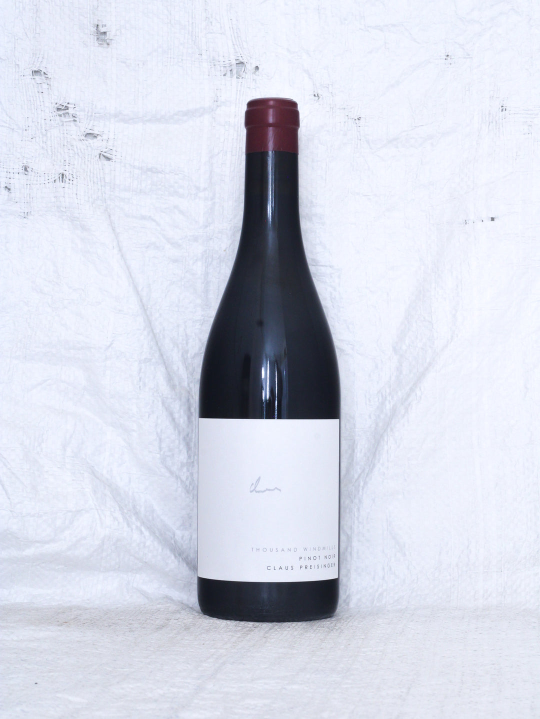 Pinot Noir Thousand Windmills 2025 von Claus Preisinger aus Gols im Burgenland – biodynamischer Bio Rotwein, Vorderansicht der Weinflasche.